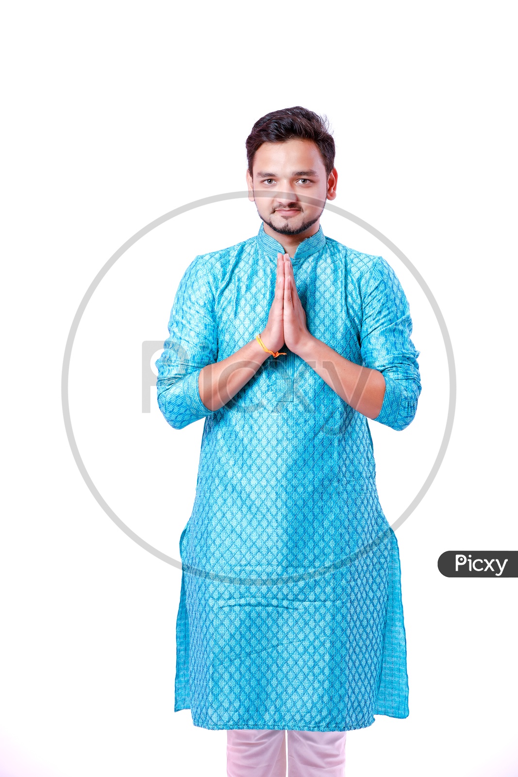 Indian Young Man With Shopping Bags And With a Smiling face and Saying Namaste Gesture on an isolated White Background