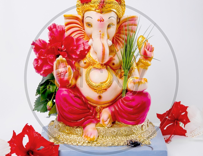 Lord Ganesh Idol with beautiful colours in the foreground