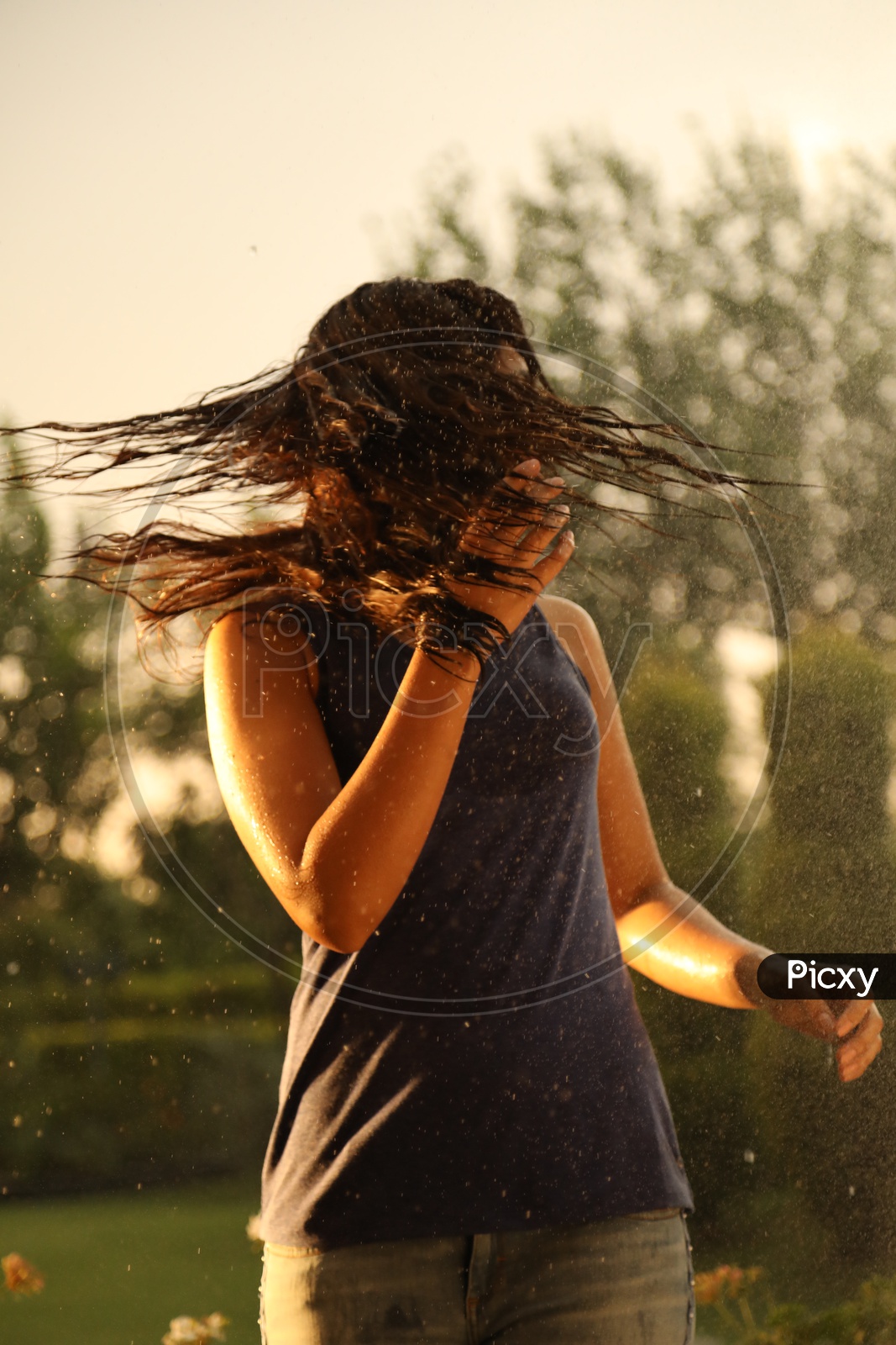 Young Girl Swirling her wet Hair