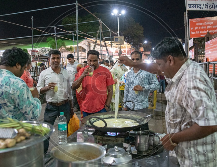 Pilgrims / Tourists Having Hot Almond Milk From a Street vendor Stall