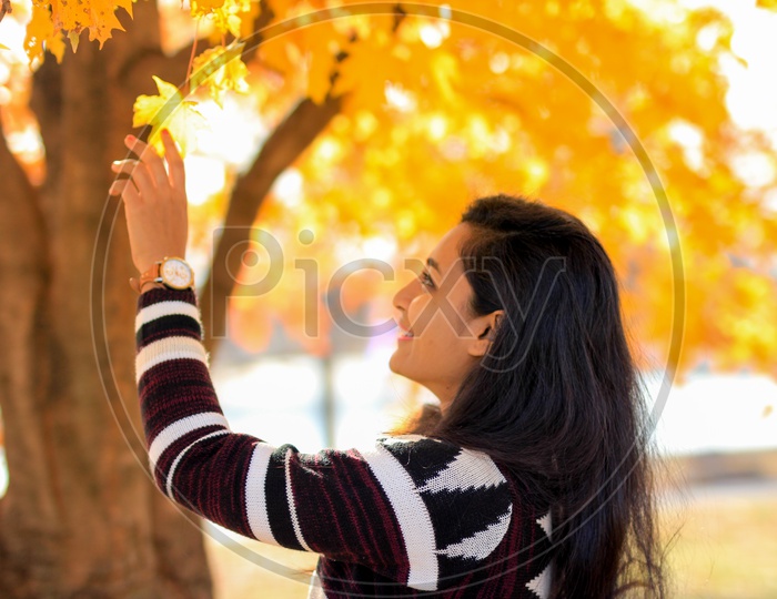 Female model with fall colors in the background
