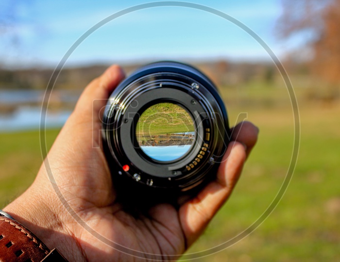 Landscape seen as inverted through the lens