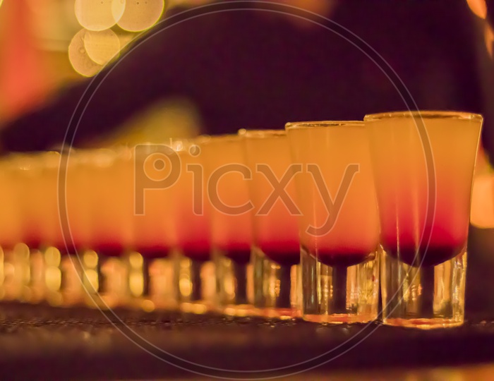 wine glasses with bokeh background. row of drink glasses