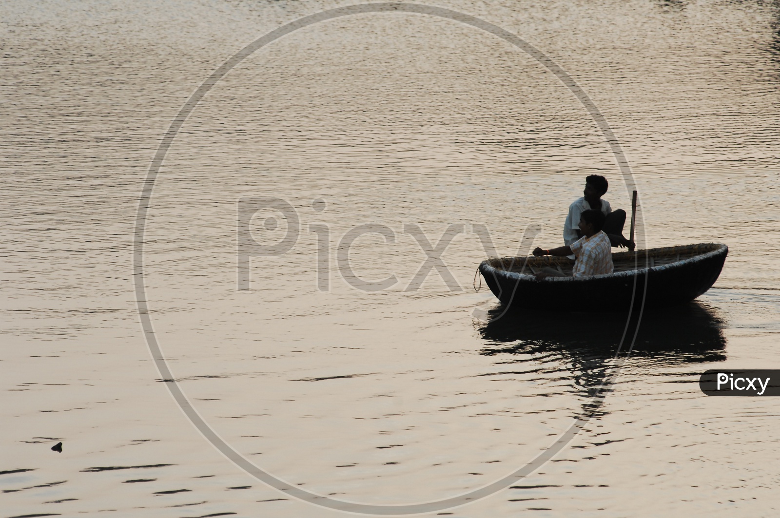 Indian Man On Coracle Boats