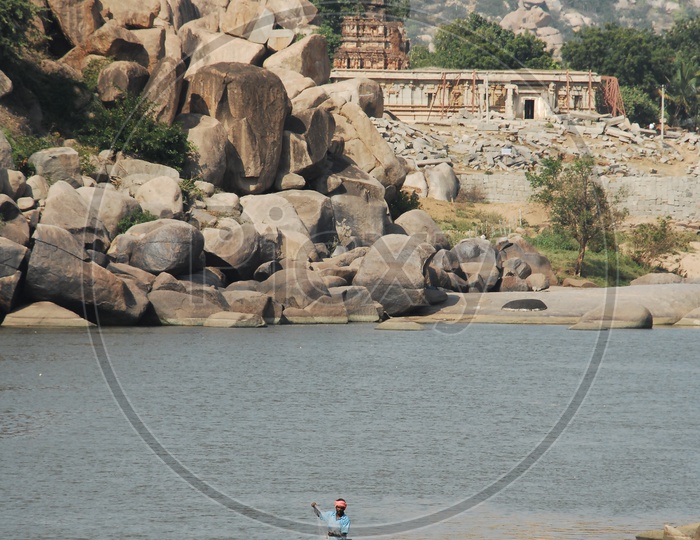 Indian Fisherman Fishing On a Coracle