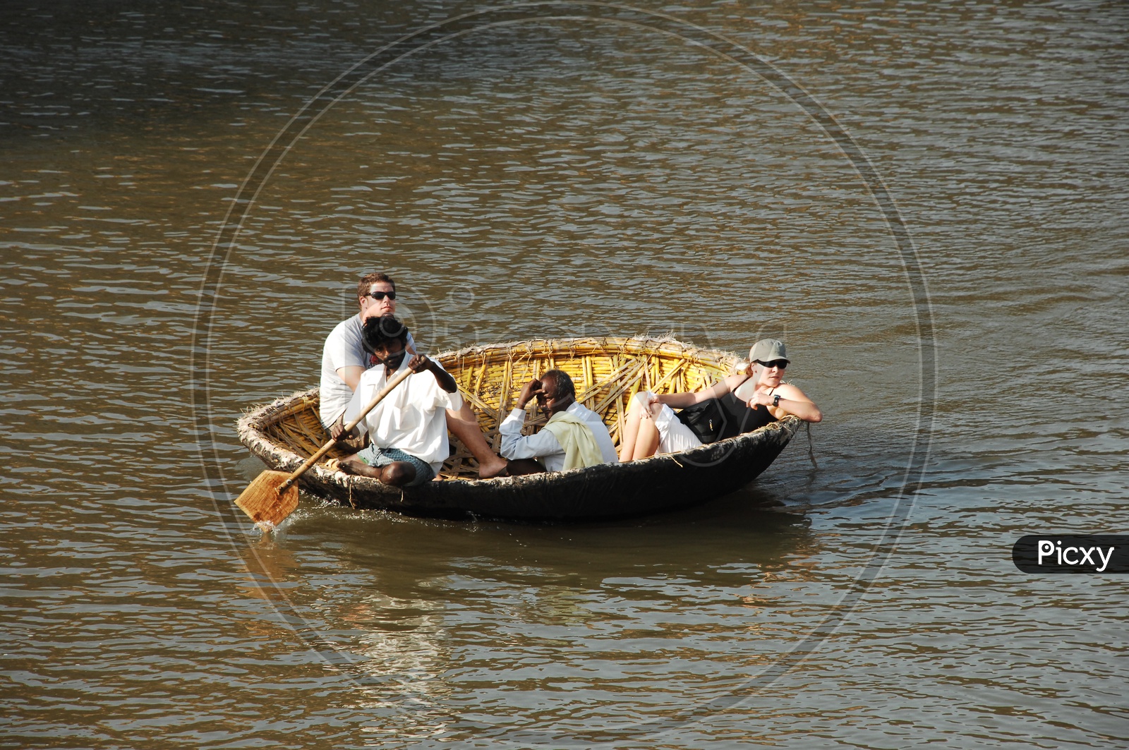 Foreigners On a Indian Coracle Boat