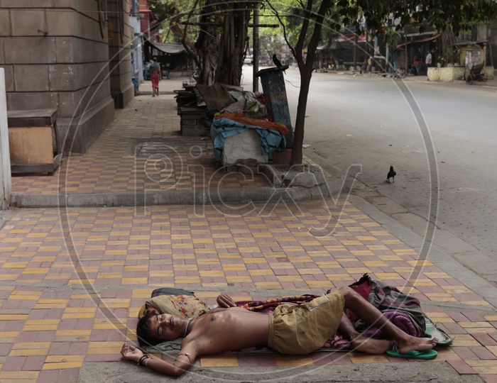 Indian Beggar  Sleeping On Footpaths Of India