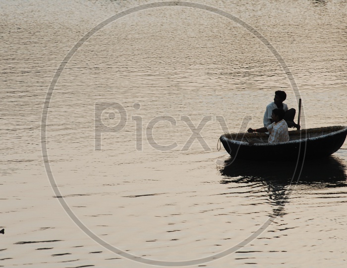 Indian Man On Coracle Boats