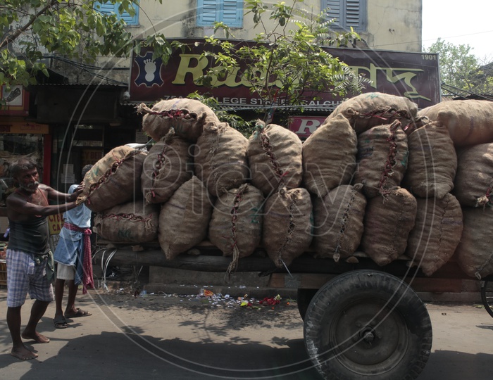 Indian Cart Pullers With Heavy Weights