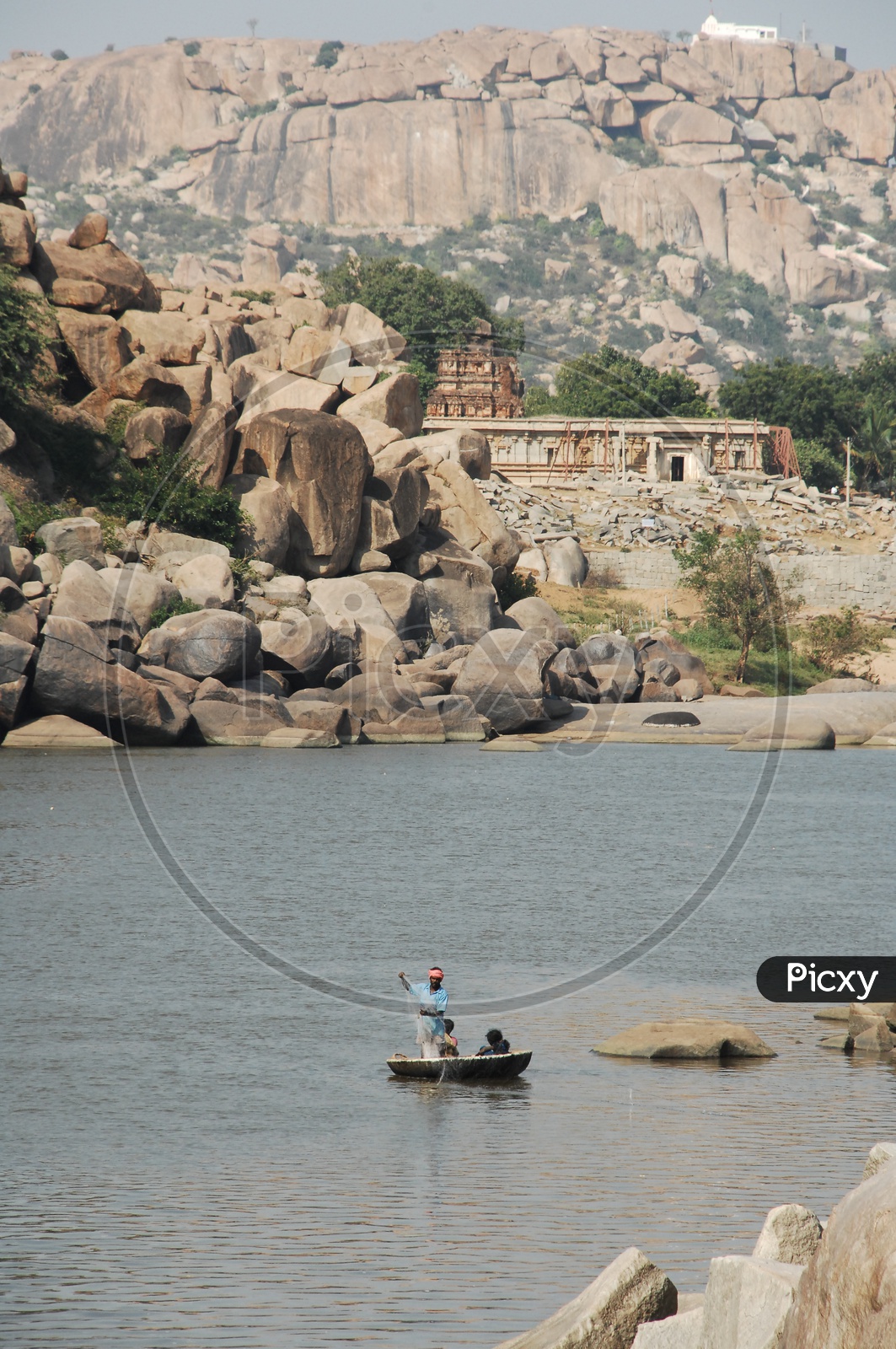 Indian Fisherman Fishing On a Coracle