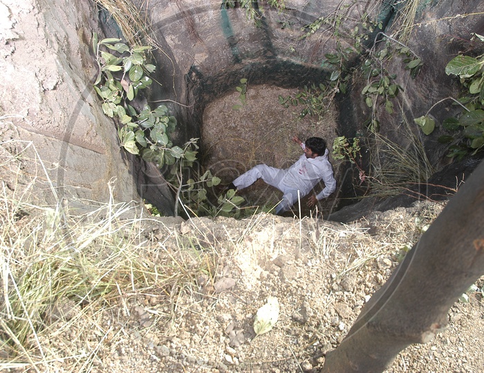 Indian Man in a well