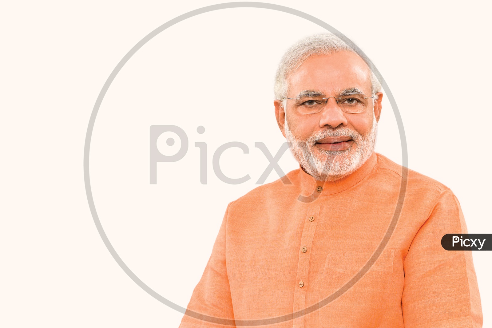 Prime Minister of India Narendra Modi smiling with white background in orange suit