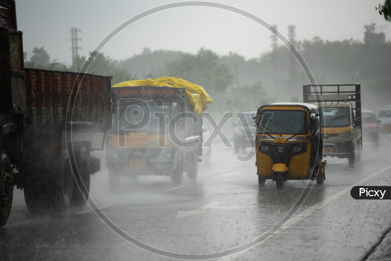 Trucks And Vehicles  Drenching And Fast Moving in Rain On National Highway
