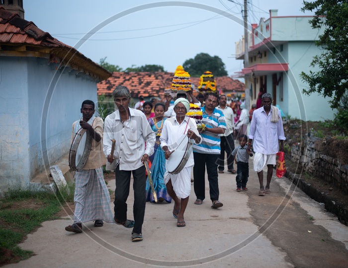 People carry Bathukamma, a floral decoration  on Saddula bathukamma (pedda bathukamma) day in Telangana.