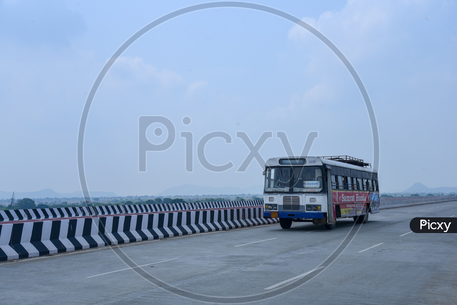 A bus moving on the bridge built on Mulavagu River in Shabaspalli