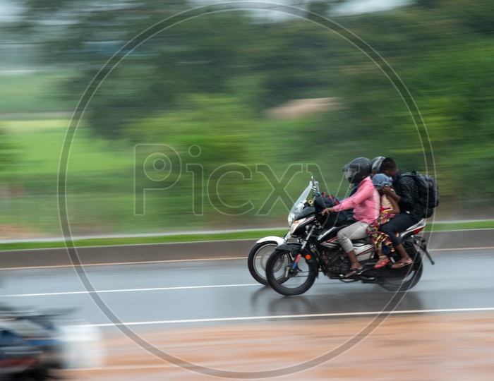 Fast Moving  Bikes Or 2 Wheeler in Heavy Rain on National Highway