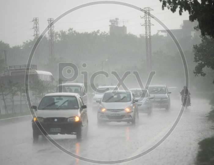 Cars Drenching In Heavy Rain  On National Highway