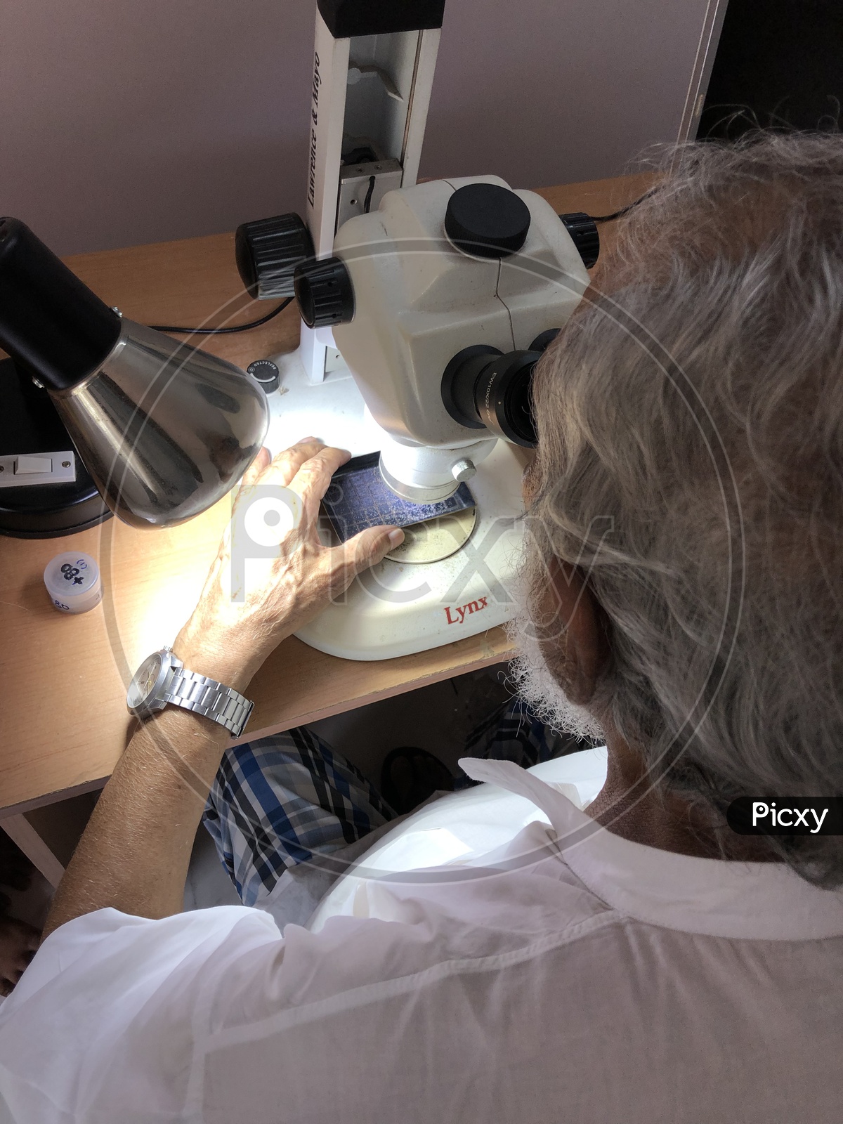 A Scientist during micropaleontological study