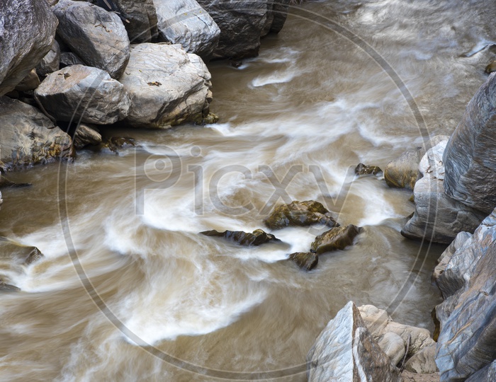 River Flowing With Stream  over Rocks As  a Channel