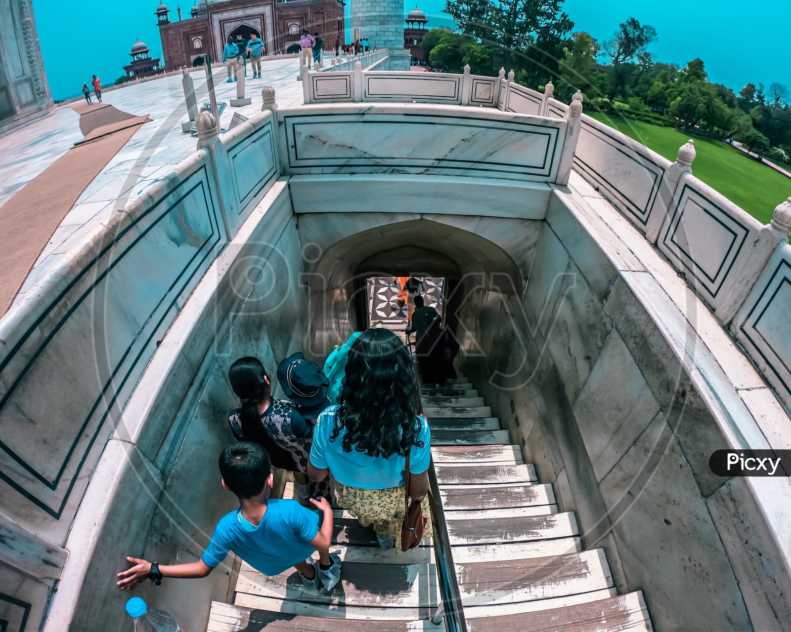 Tourists taking the steps out of the mausoleum