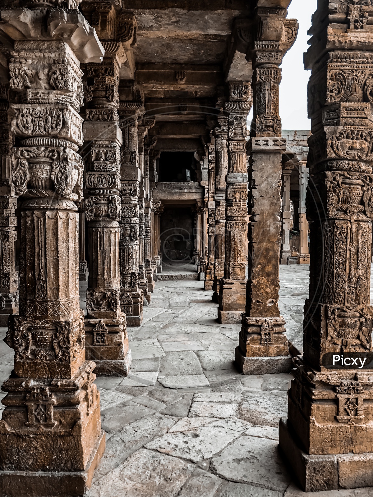 Intricating Stone Carved Pillars of Qutub Complex