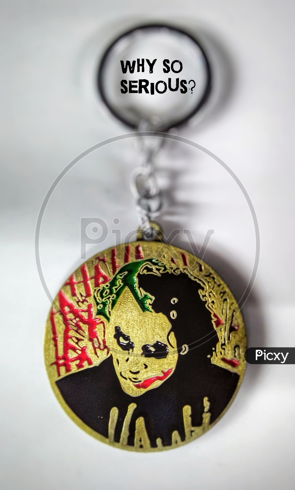 Joker keychain placed on a white table
