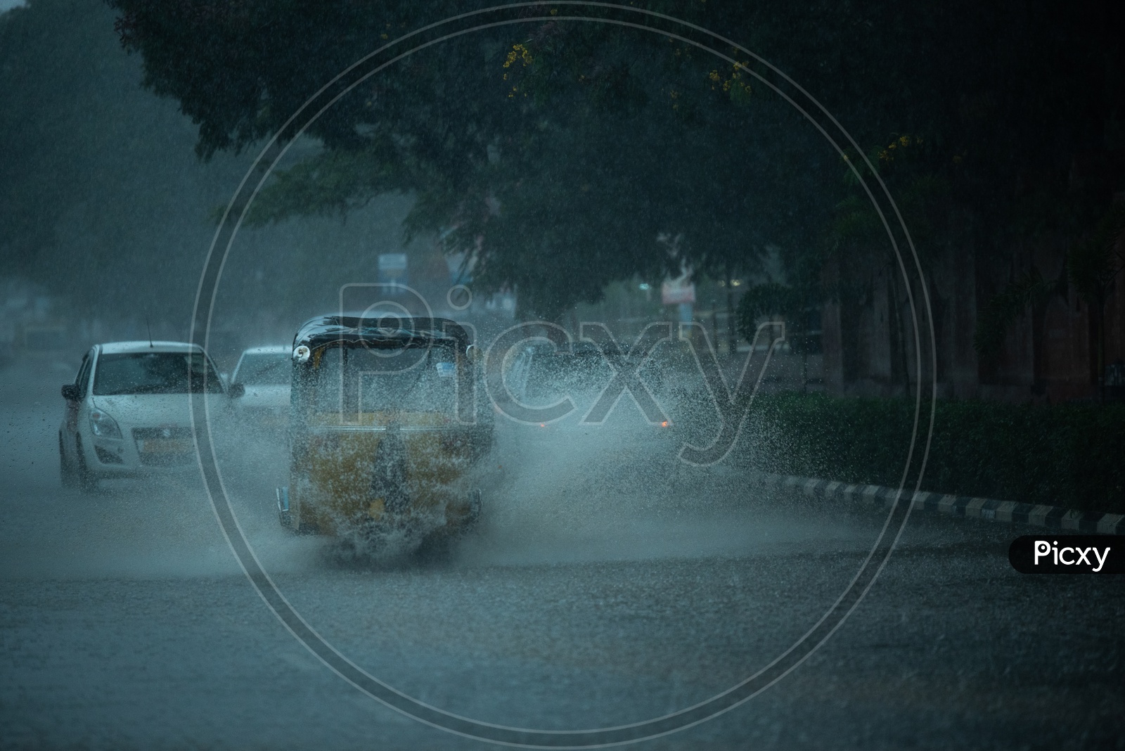 Auto on Flooded Road During Heavy Rain Near Hi-tech City