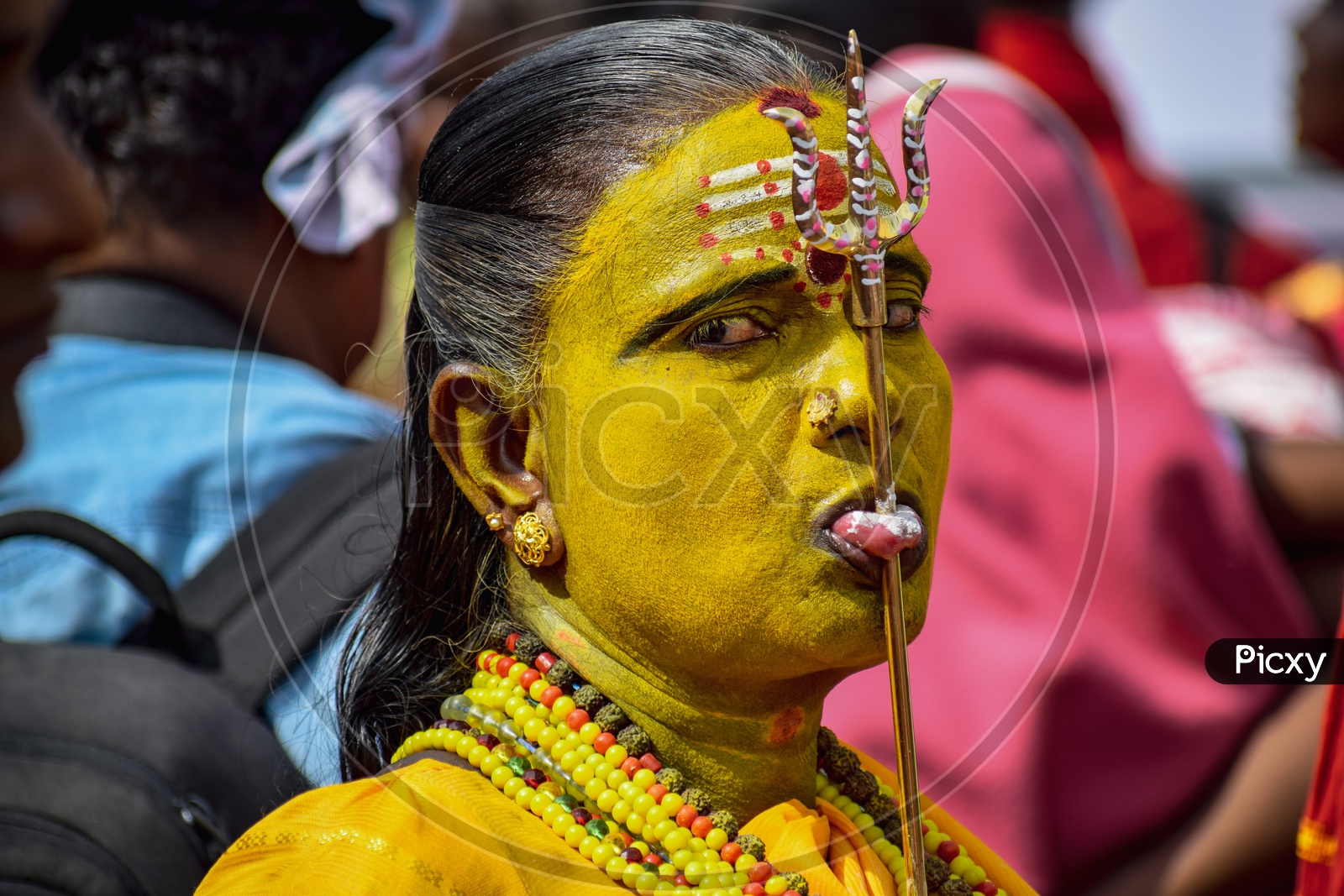 A woman pierced her toungue with a trishool, Indian Superstition