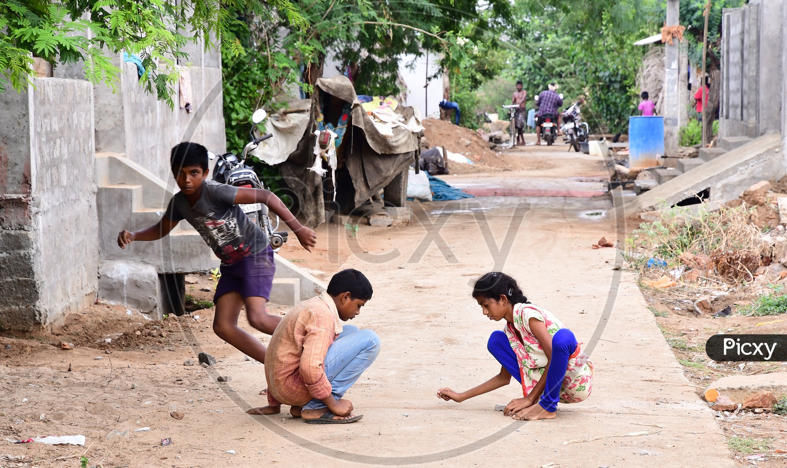 Children Playing  Games On Streets Enjoying Their Vacation
