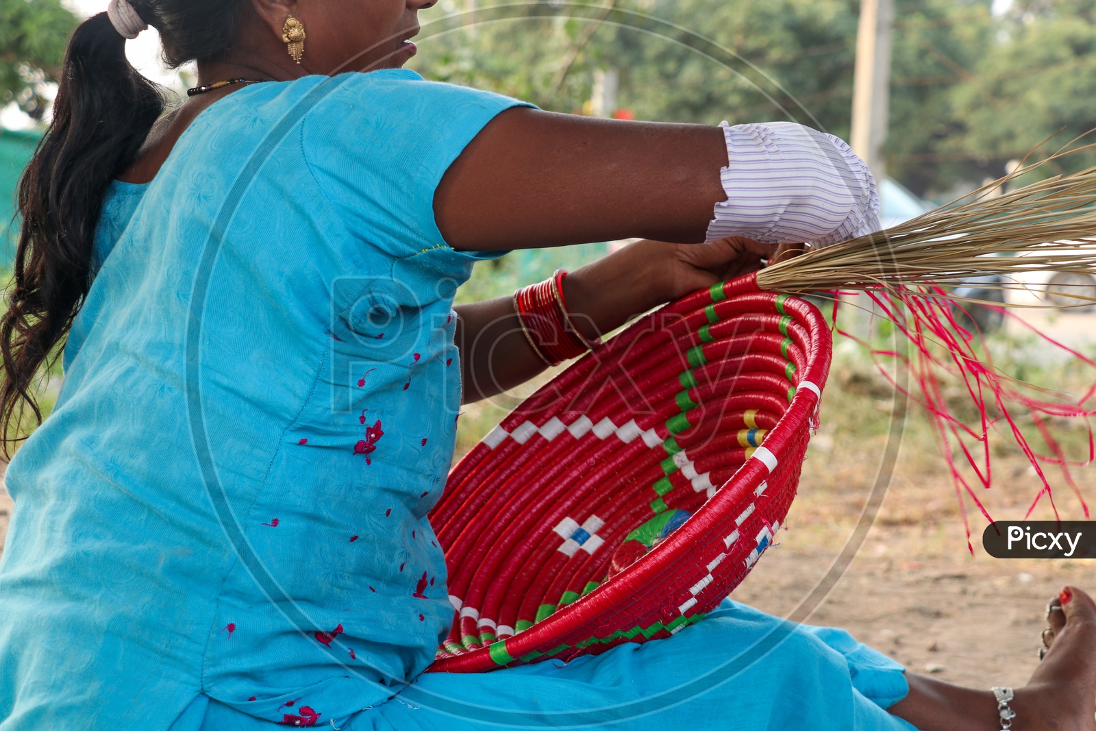 Indian Woman Hand Weaving Baskets