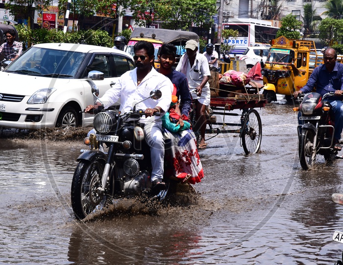 Commuting Vehicles On Flooded Roads Due To Heavy Rains