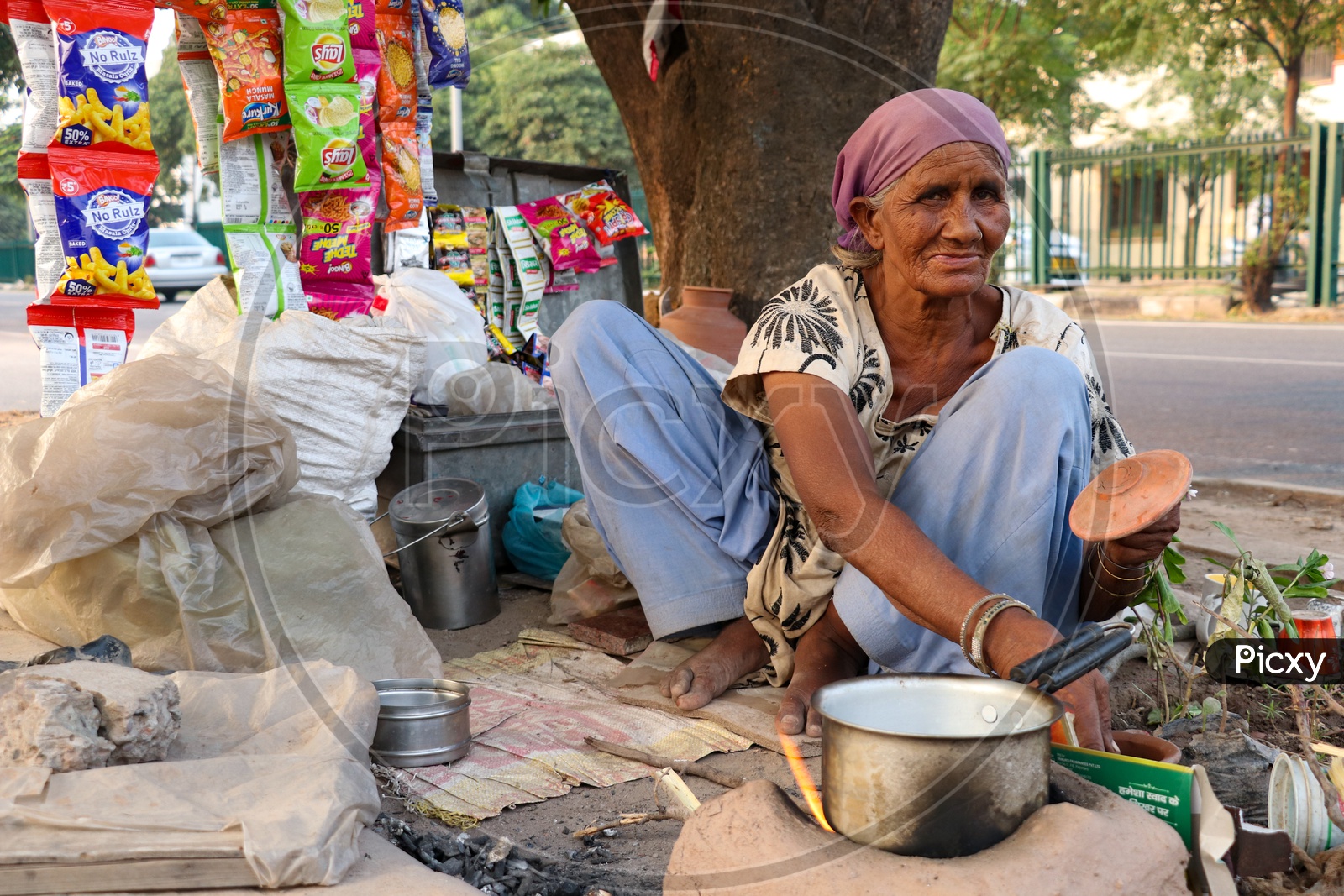 An Old woman Selling Tea On Road Side