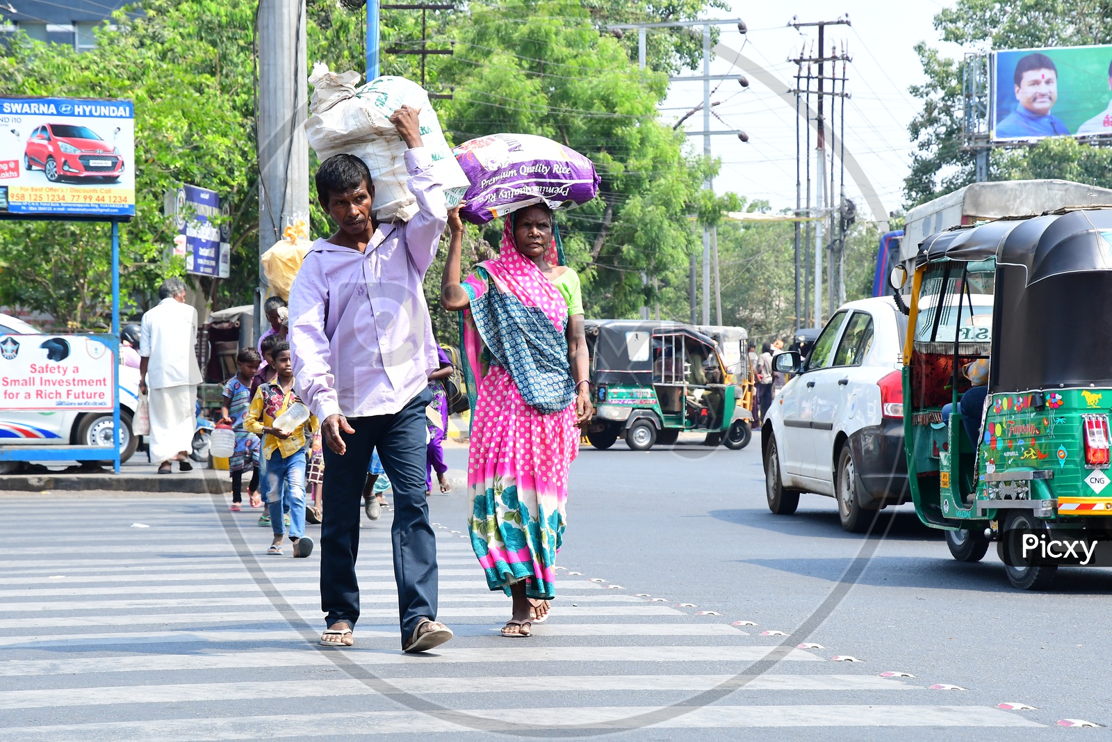 Indian People carrying load on their shoulders