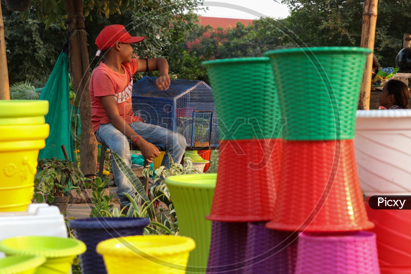 Colorful Flower Pots Being Selling at a Road Side Vendor Stall