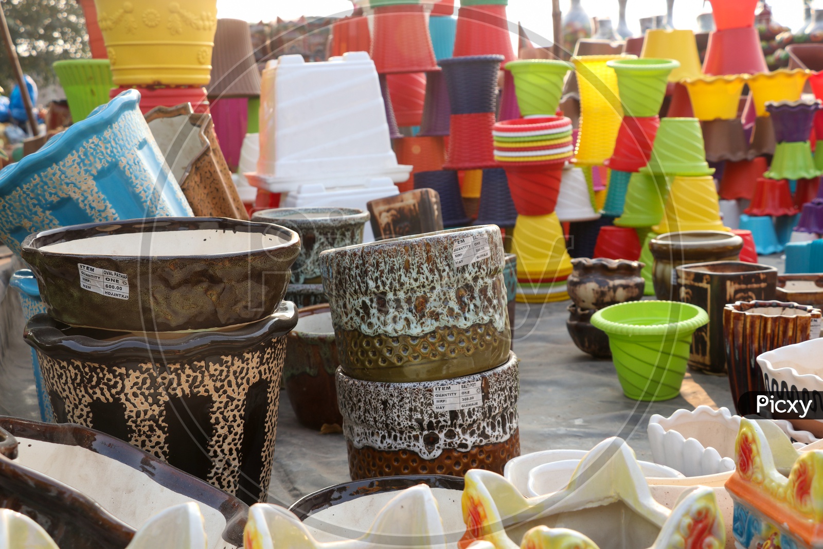 Colorful Plant Pots Being sold At a Road Side Vendor Stall