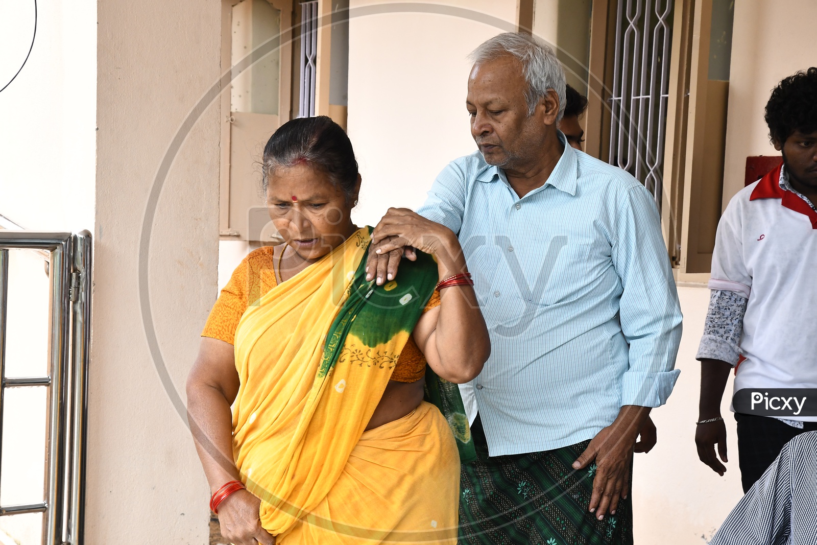 Indian Wife Taking Care of Husband In an Old-Age Home