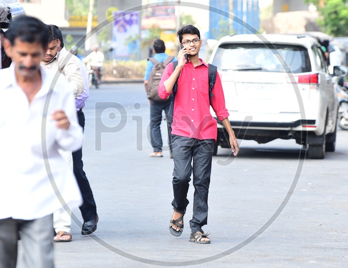 Indian College Student walking talking on the phone