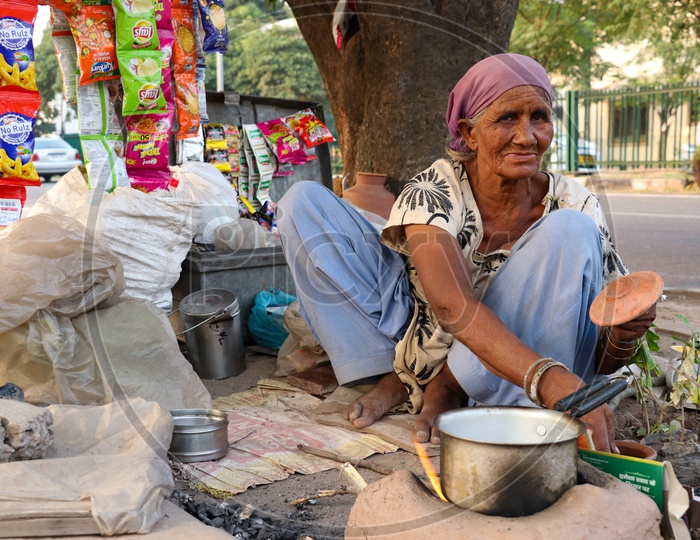 An Old woman Selling Tea On Road Side