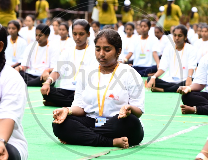 Indian Girl meditating at Art of Living Happiness Center, Vijayawada