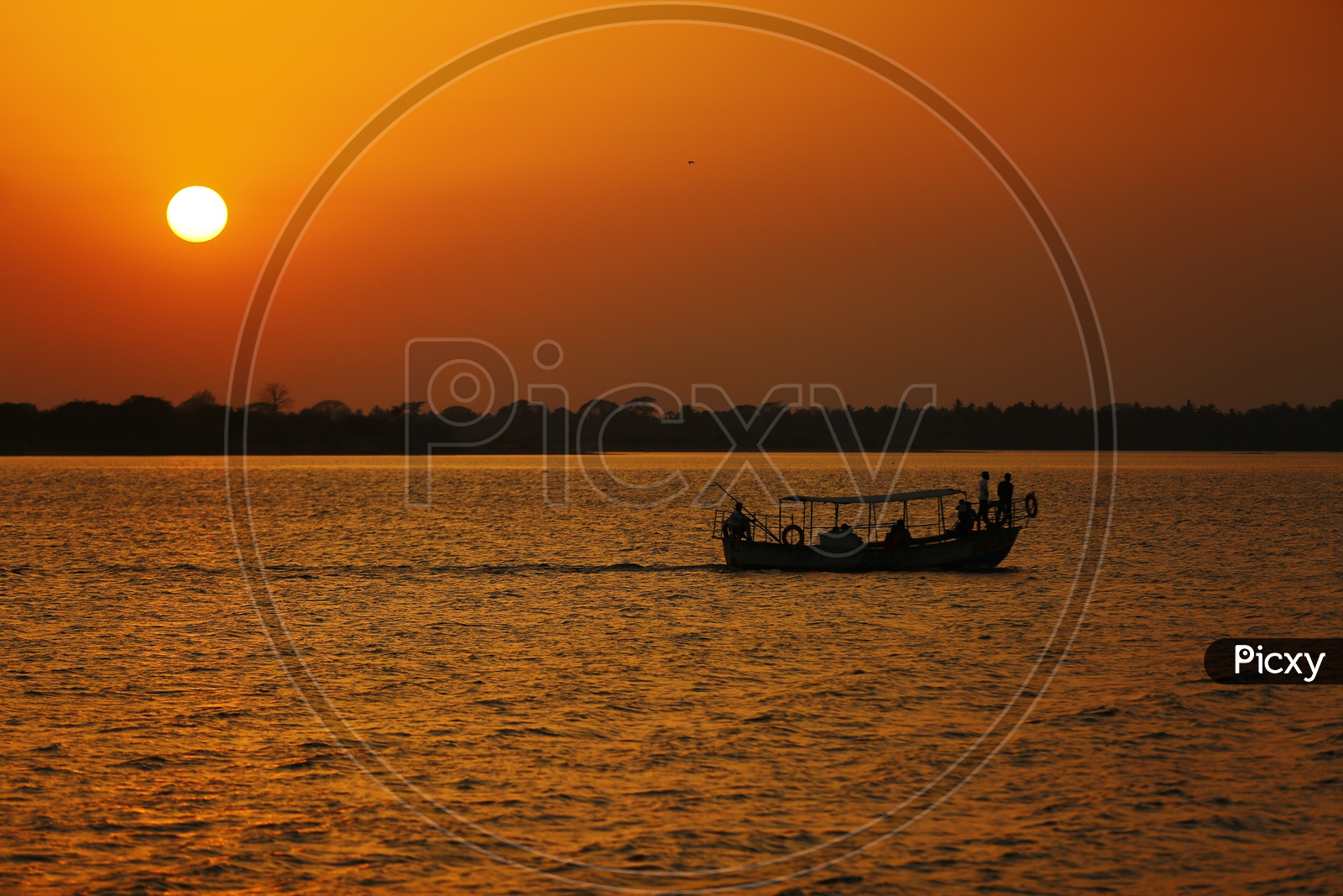 Silhouette Of a Fishing Boat on Godavari River With Sunset Sky Backdrop