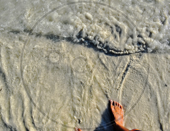 Ocean water touching toes