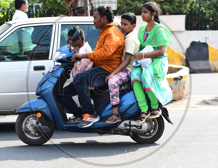 Indian Family going on a scooty in Vijayawada