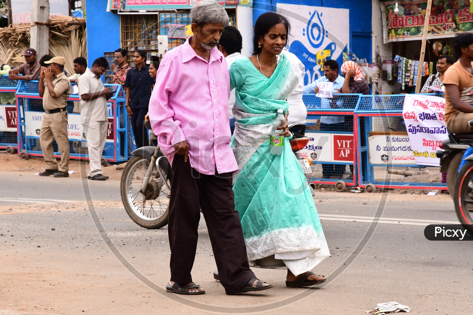 Indian Elderly couple walking on the road