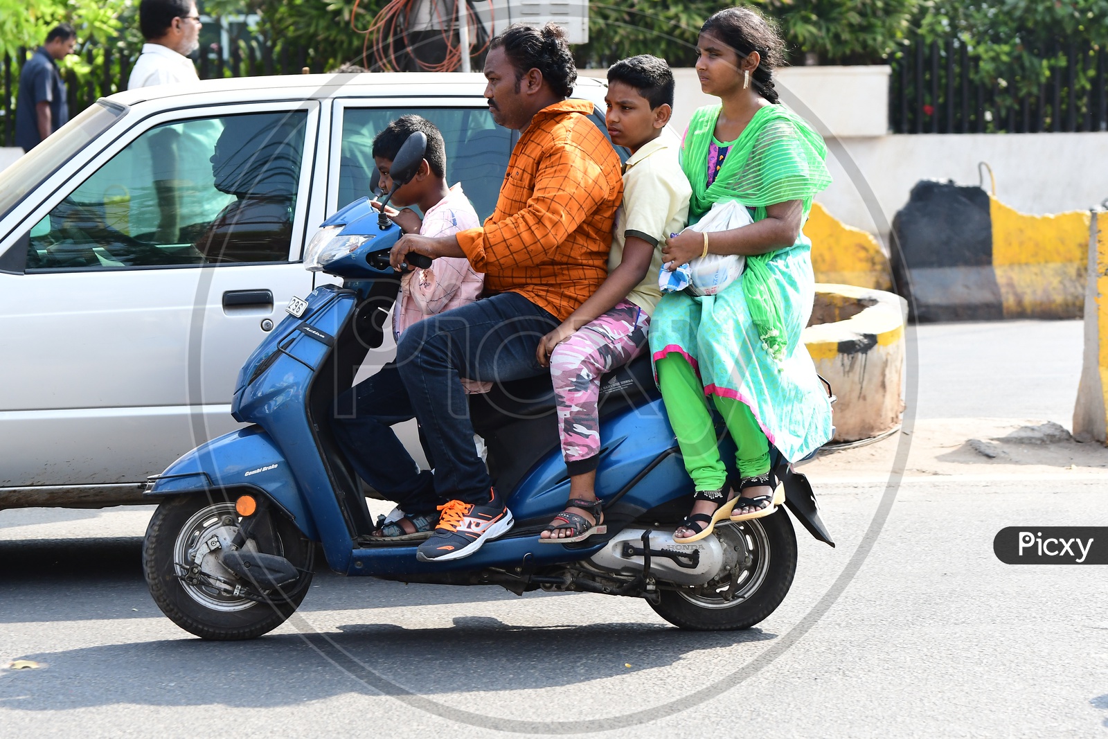 Indian Family going on a scooty in Vijayawada