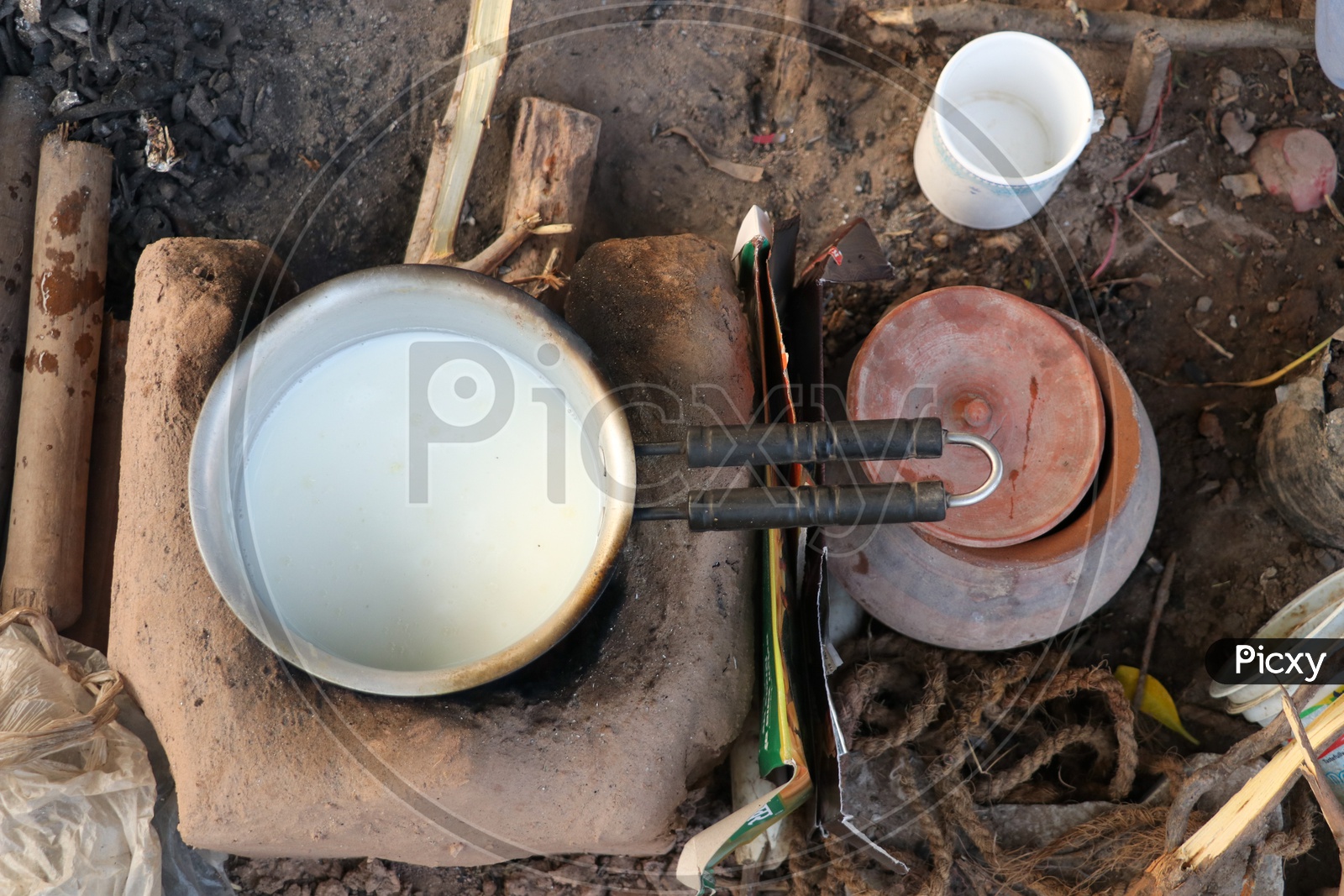 Tea Making  Ob Traditional Clay Stove With Fuel As Wooden Sticks