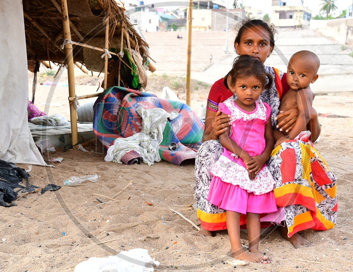 Indian Migratory Families Mothers With Their Children at Huts Built With Banners