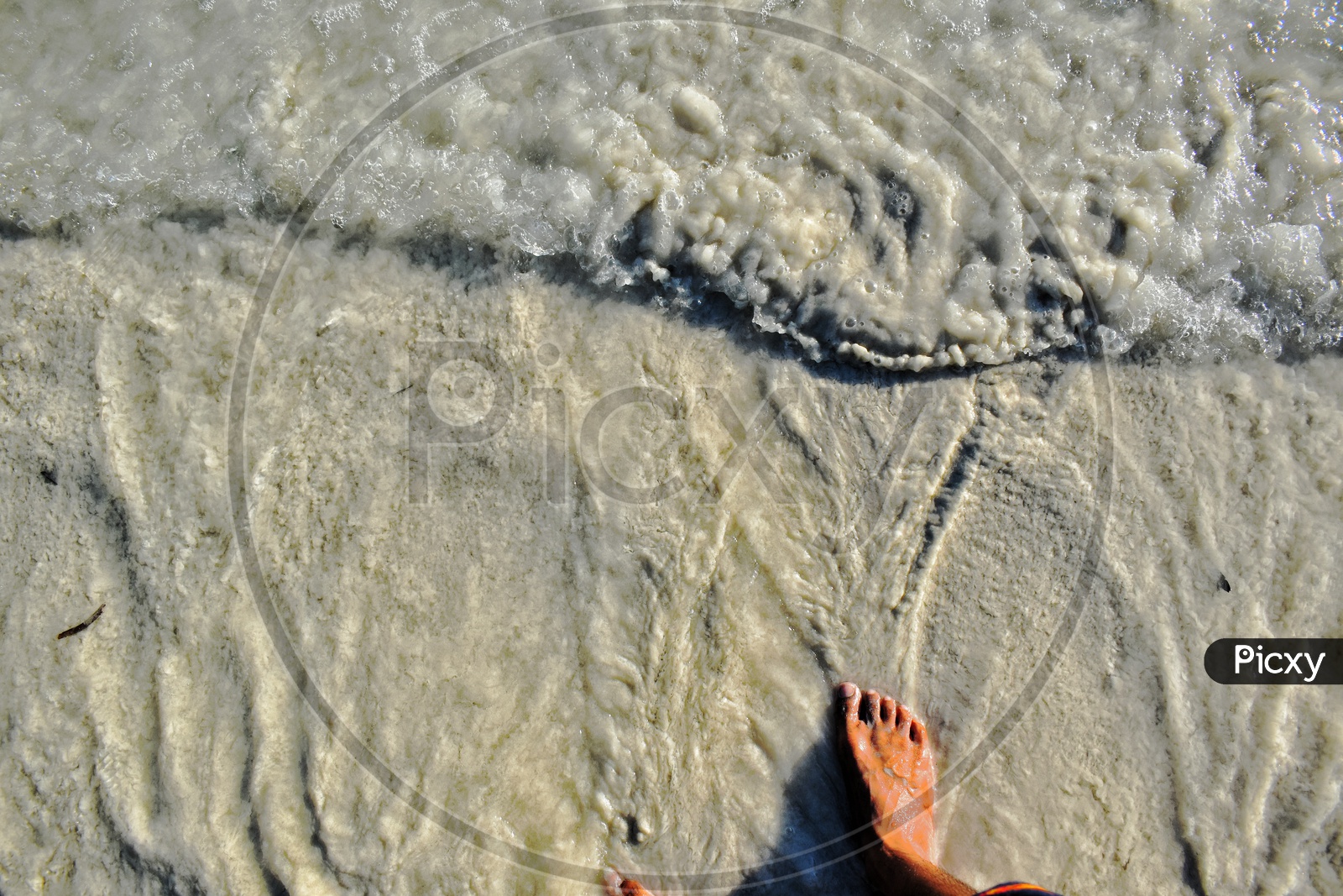 Ocean water touching toes