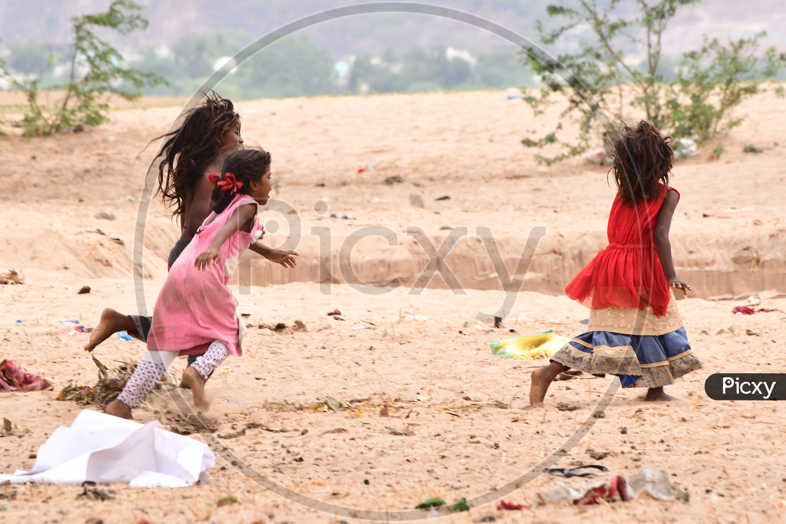 Indian Rural kids playing in the sand
