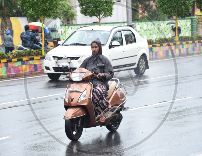 Commuting Vehicles in Heavy Rains On Vijayawada Roads