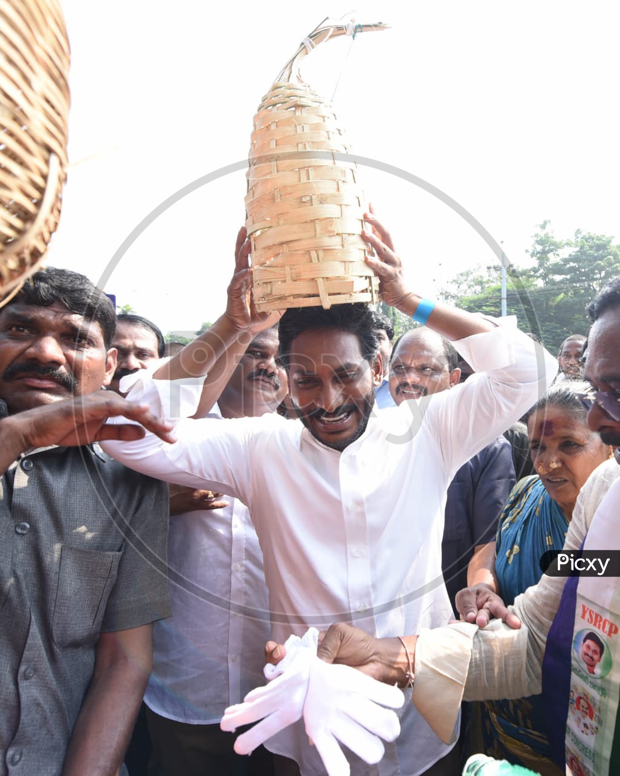 AP CM YS Jagan Mohan Reddy putting on a handicraft crown